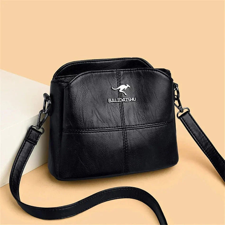 Women's Faux Leather Paneled Zip-Top Adjustable Crossbody Bag - Black