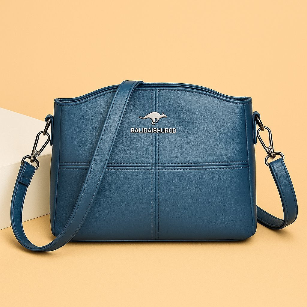 Women's Faux Leather Paneled Zip-Top Adjustable Crossbody Bag - Sky Blue