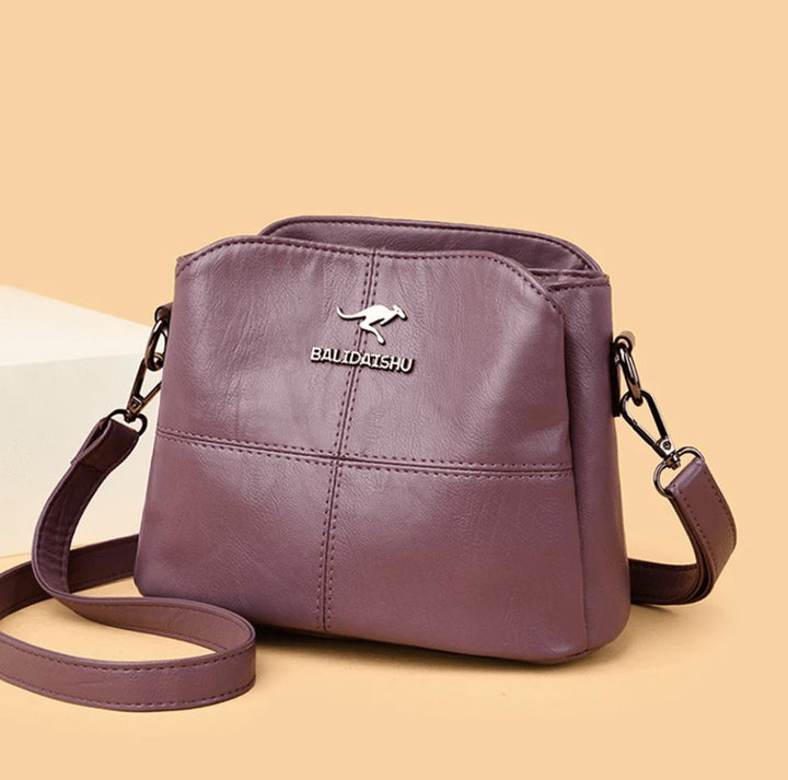 Women's Faux Leather Paneled Zip-Top Adjustable Crossbody Bag - Purple